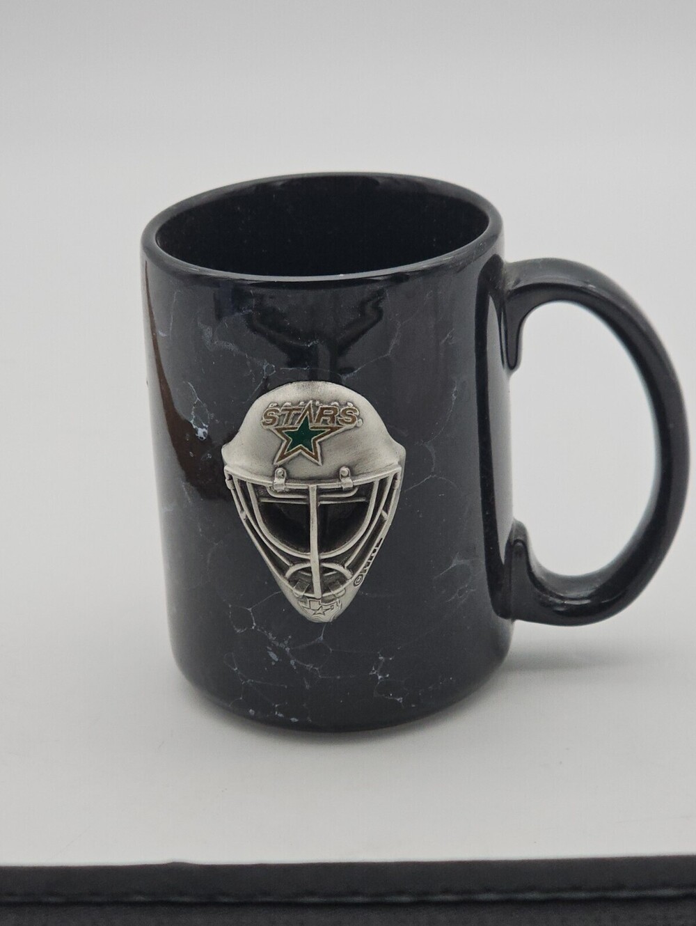 Official NHL Dallas Stars black ceramic mug with 3D pewter goalie mask emblem.